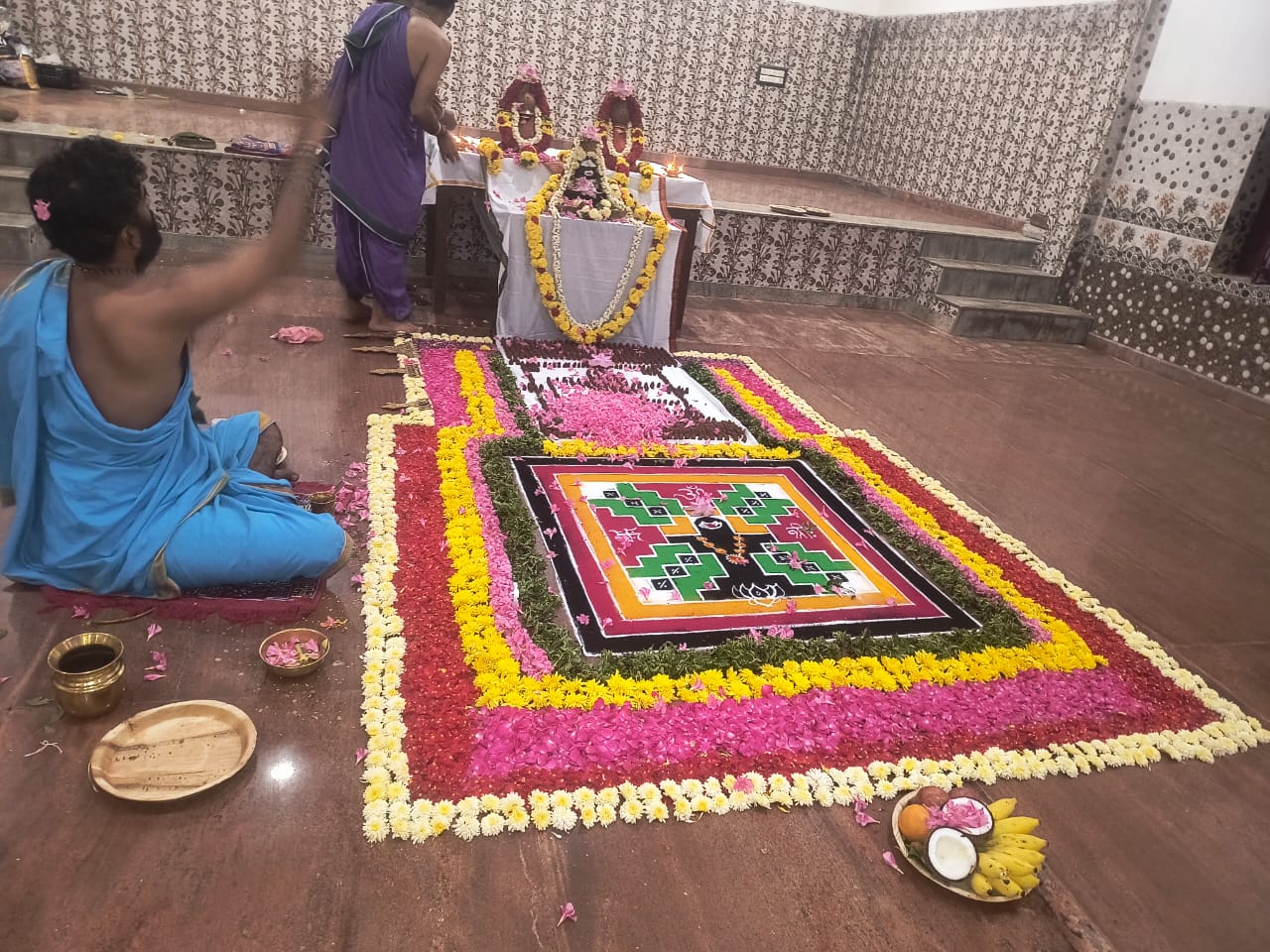 Pooja planning scene with ritual checklist, offerings and temple preparation materials